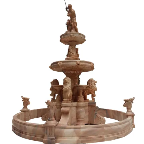 Grande fontana in pietra di marmo rosso all'aperto con statue di uomini e leoni