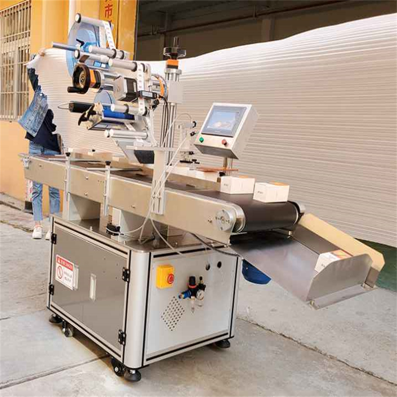 Automatic top labeling machine