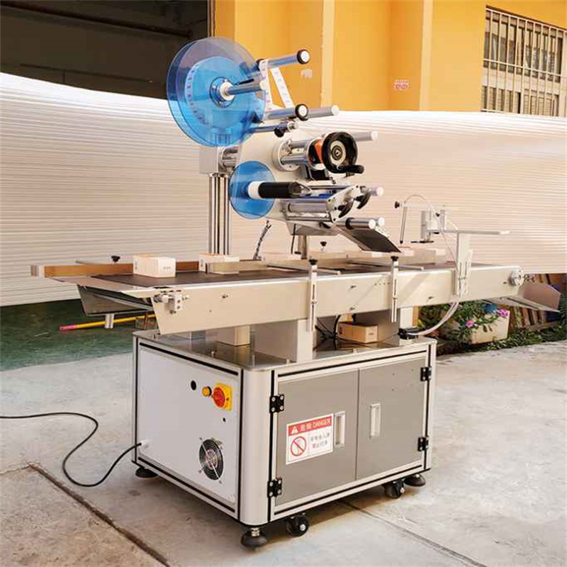 Automatic top labeling machine