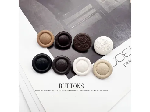 Combining leather covered buttons with decorative elements