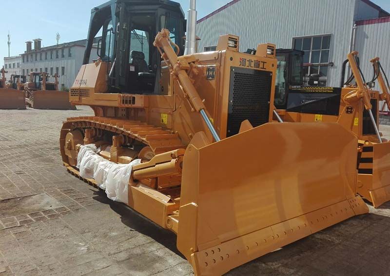 A motor grader, resembling the artist of roads, carefully crafts smooth surfaces from rough terrain, ensuring travelers enjoy a safe and comfortable journey.