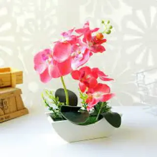Add a touch of exotic beauty and texture to your home and office decor with our handcrafted silk orchid arrangements.