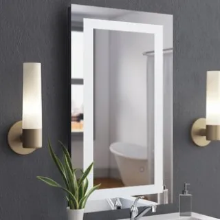 The mirror is embedded in the metal frame, it floats from the edge of the frame and is protected by the surrounding metal frame