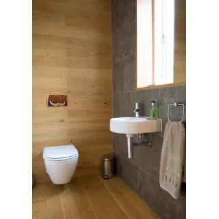 Floor-mounted toilets take up more bathroom space than wall-mounted toilets because you need to accommodate both the toilet and the tank.