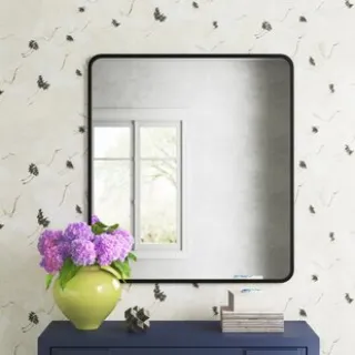 This mirror instantly adds depth and reflective beauty to any interior. The elegant metal framed mirror is the perfect size to fit in almost any space and ready to hang for easy installation.