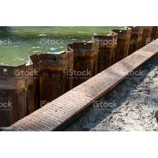 A full sheet pile wall consists of joints of adjacent sheet pile sections installed in sequence.