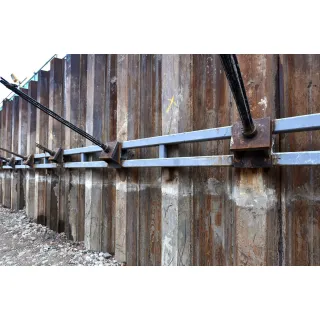U-shaped sheet piles interlock between adjacent sheet piles. It is located at the edge of each unit.