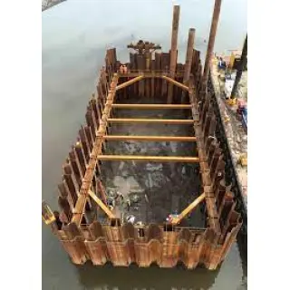 Cofferdams are often installed in challenging conditions that require the use of large amounts of heavy equipment and floating barges.