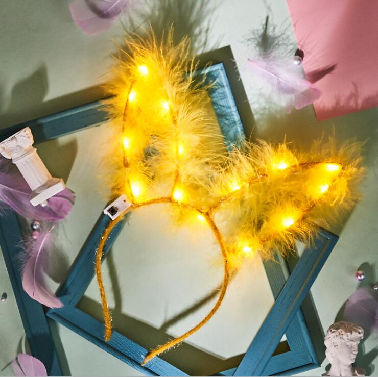 Venta al por mayor encantadora luz intermitente led hasta plumas orejas de conejo juguetes de aro para el cabello en un lugar escénico estilo caliente diadema para niños