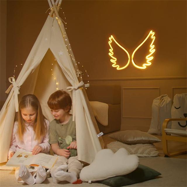 Hermosa luz de neón LED con alas de ángel