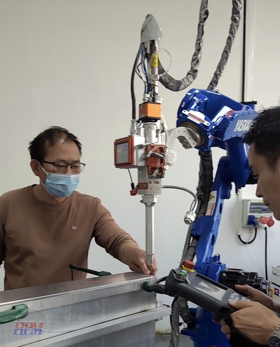 6-Axis robot laser welding machine is running