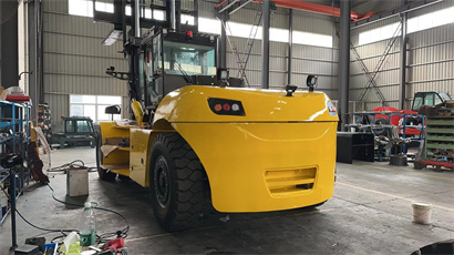 busy workshop with full of forklift and telehandler