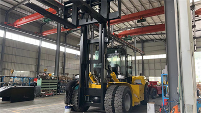 busy workshop with full of forklift and telehandler