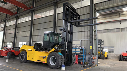 busy workshop with full of forklift and telehandler