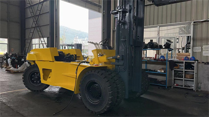 busy workshop with full of forklift and telehandler