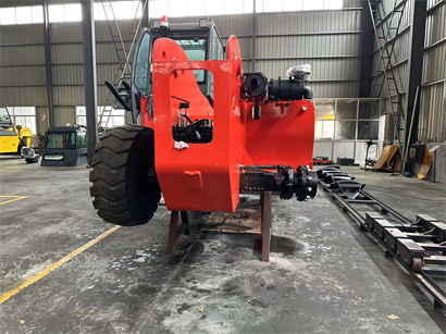 busy workshop with full of forklift and telehandler