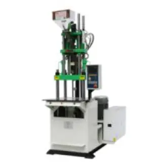Vertical injection molding equipment uses an open clamp and turntable design.