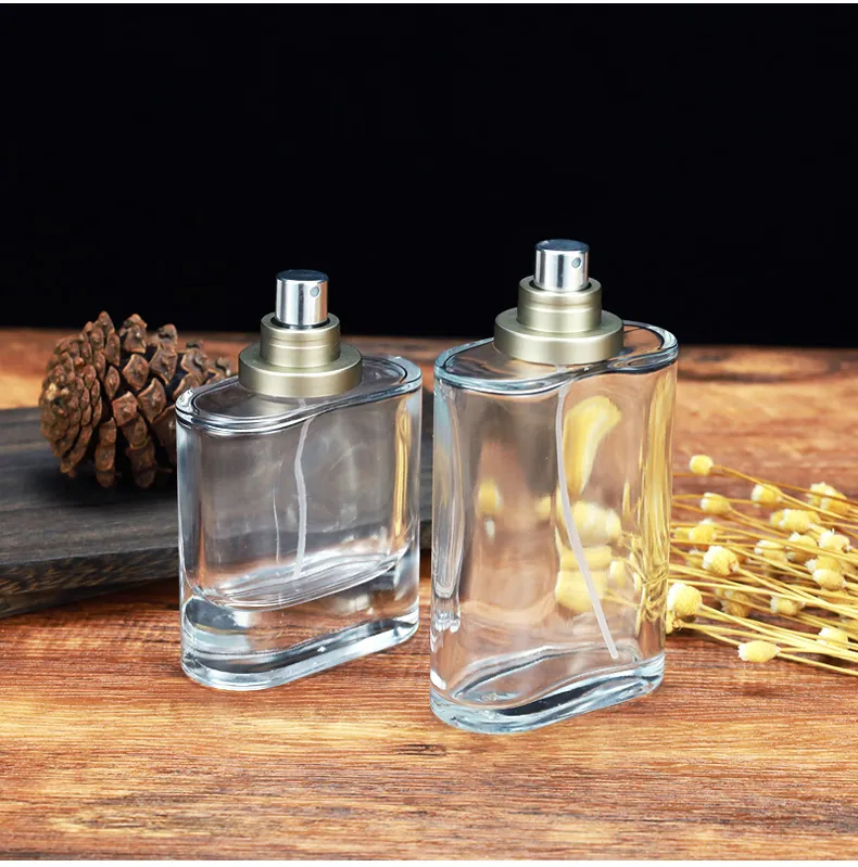 Flat round glass perfume bottle