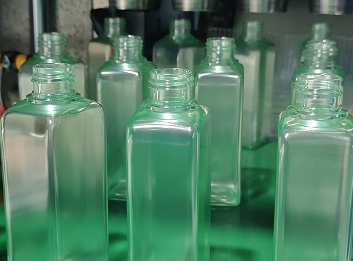 clear green lotion serum bottle