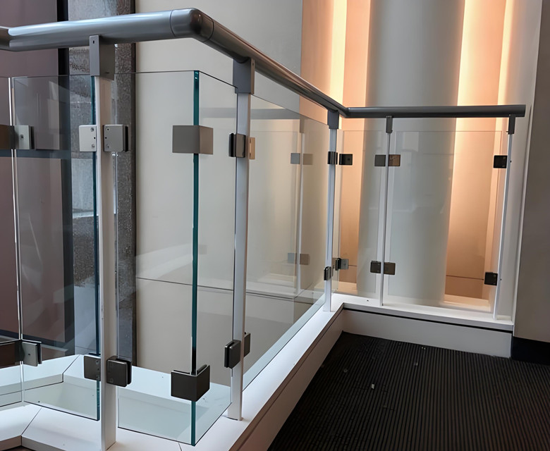 How often should I clean my glass stair railings to prevent damage？