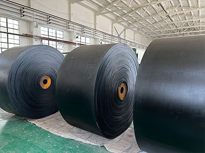 What ply material is a conveyor belt made of?