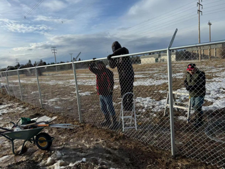 Outdoor building fence installation: Worker operation scene and the ...