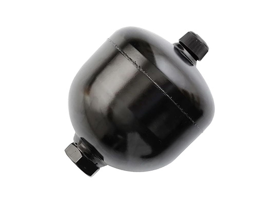 What does a hydraulic accumulator do?