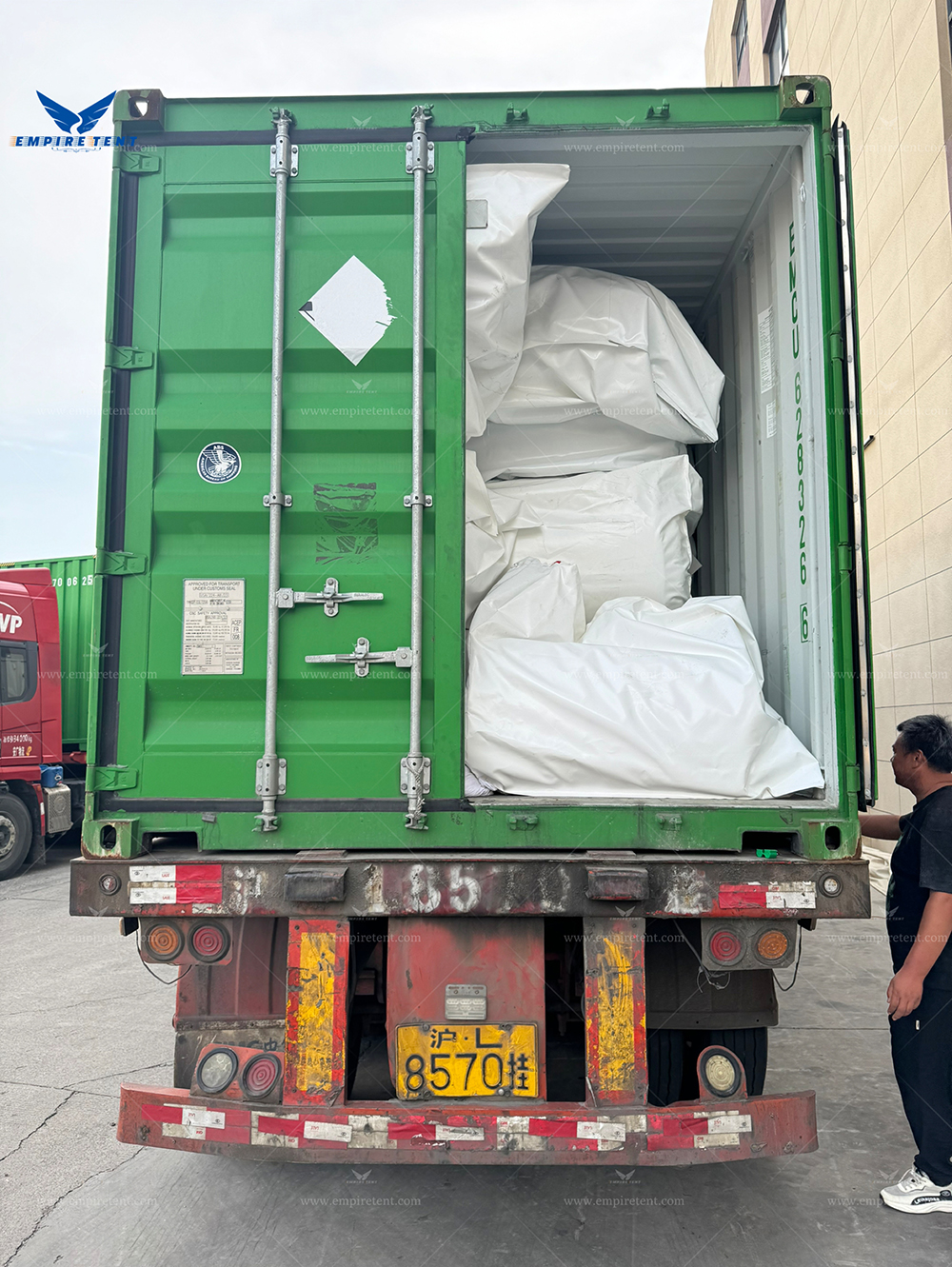 a large tent 30x35m with insulated roof and sidewalls in 3 containers for shipment to UK