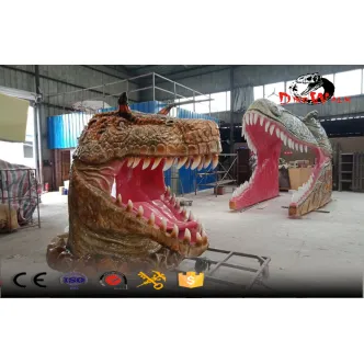 Parque de atracciones con cabeza de dinosaurio gigante de fibra de vidrio