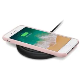 Wireless charging uses a base station or charging pad to transmit power using electromagnetic waves.
